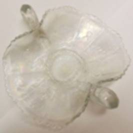 A glass vase with a flower design

AI-generated content may be incorrect.