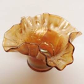 A brown glass vase with ruffled edge

AI-generated content may be incorrect.