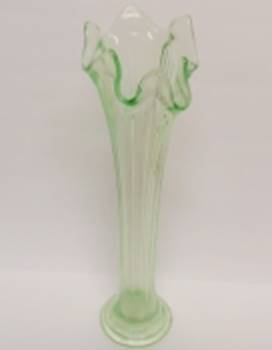 A green glass vase with a horse head

AI-generated content may be incorrect.