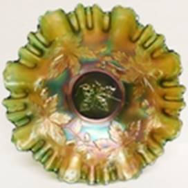 A green and gold glass bowl

AI-generated content may be incorrect.