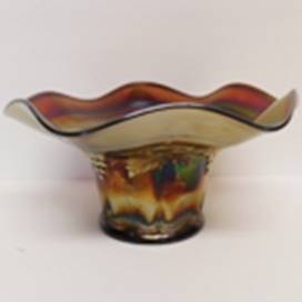 A glass vase with a wavy edge

AI-generated content may be incorrect.
