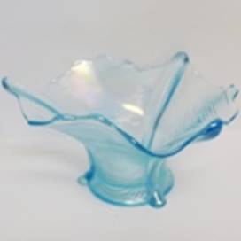 A blue glass vase on a white background

AI-generated content may be incorrect.