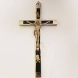 A cross on a white surface

AI-generated content may be incorrect.