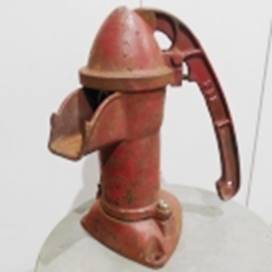 A red metal water pump

AI-generated content may be incorrect.