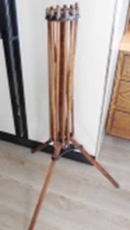 A wooden stand with a wooden handle

AI-generated content may be incorrect.