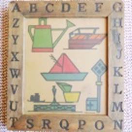 A picture frame with letters on it

AI-generated content may be incorrect.