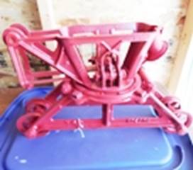 A red metal object on a blue plastic container

AI-generated content may be incorrect.