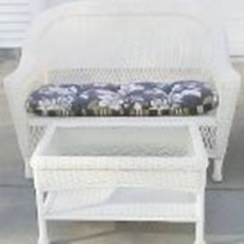 A white wicker chair with a blue cushion

AI-generated content may be incorrect.