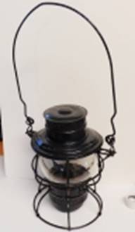 A black lantern with a black wire

AI-generated content may be incorrect.