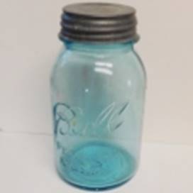 A blue glass jar with a metal lid

AI-generated content may be incorrect.