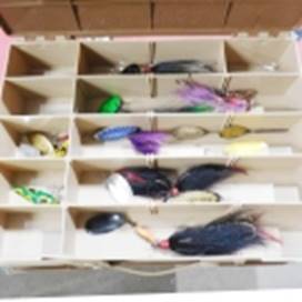 A box with fishing lures in it

AI-generated content may be incorrect.