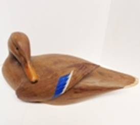 A wooden duck with a blue stripe

AI-generated content may be incorrect.