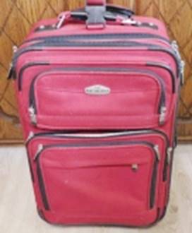 A red suitcase with zippers

AI-generated content may be incorrect.