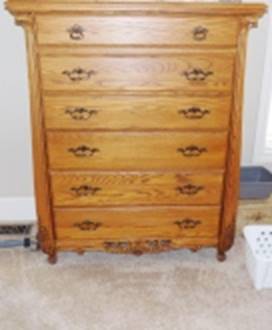 A wooden dresser in a room

AI-generated content may be incorrect.