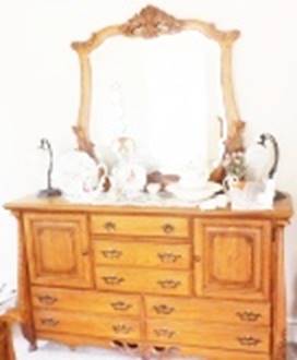 A dresser with a mirror

AI-generated content may be incorrect.