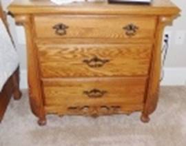A wooden dresser with a lamp on the side

AI-generated content may be incorrect.