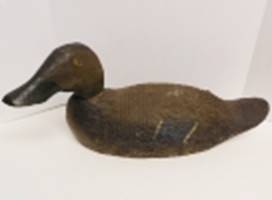 A wooden duck sculpture

AI-generated content may be incorrect.