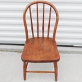 A wooden chair in front of a white wall

AI-generated content may be incorrect.