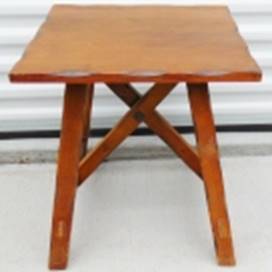 A wooden table with a x-shaped leg

AI-generated content may be incorrect.