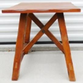 A wooden table with a x shaped leg

AI-generated content may be incorrect.