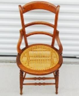 A wooden chair with a wicker seat

AI-generated content may be incorrect.