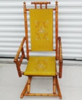 A yellow rocking chair in front of a white wall

AI-generated content may be incorrect.
