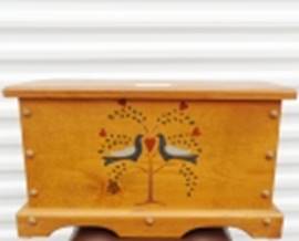 A wooden box with birds on it

AI-generated content may be incorrect.