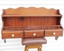 A wooden desk with drawers

AI-generated content may be incorrect.