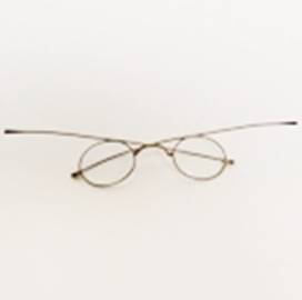 A pair of glasses on a white surface

AI-generated content may be incorrect.