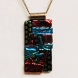 A necklace with a colorful rectangular object

AI-generated content may be incorrect.