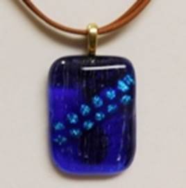 A blue glass pendant on a brown cord

AI-generated content may be incorrect.