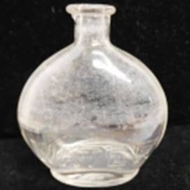 A clear glass vase on a black background

AI-generated content may be incorrect.