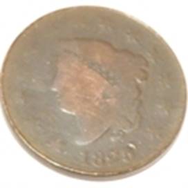 A close-up of a coin

AI-generated content may be incorrect.