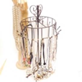 A wire basket with jewelry in it

AI-generated content may be incorrect.