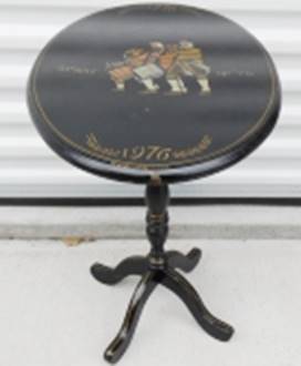 A small round table with a picture on it

AI-generated content may be incorrect.