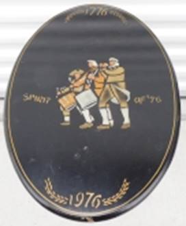 A black oval sign with a picture of men playing instruments

AI-generated content may be incorrect.
